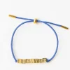 INK + ALLOY Goldie Blue Lurex Cord With Brass Letters Adjustable Breathe
