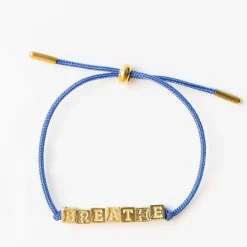 INK + ALLOY Goldie Blue Lurex Cord With Brass Letters Adjustable Breathe
