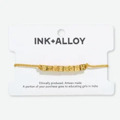 INK + ALLOY Goldie Gold Lurex Cord With Brass Letters Adjustable Strength