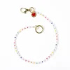 INK + ALLOY Kate White Beaded Bag Charm with Brass Heart